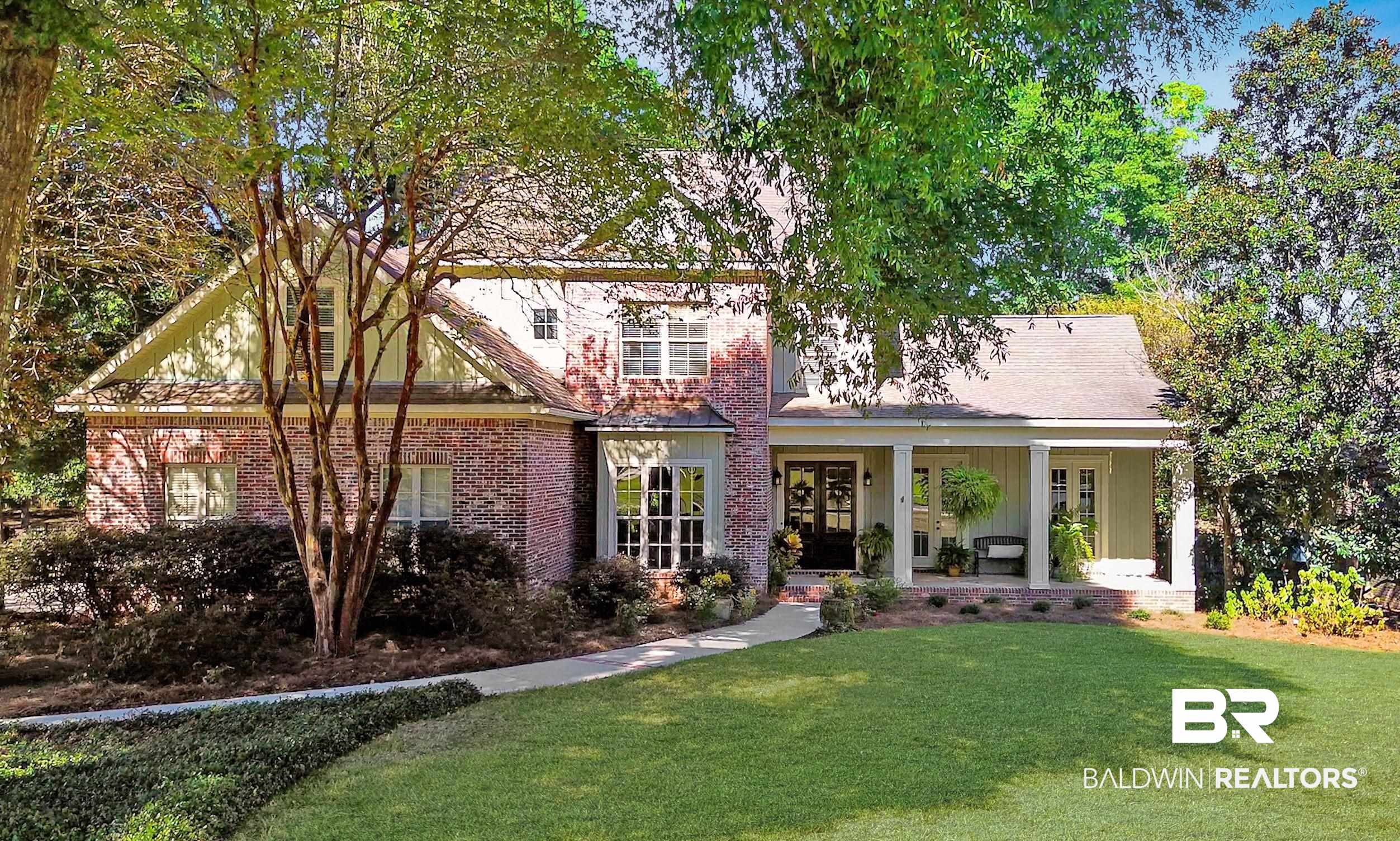 8868 Dawes Lake Road South Mobile, AL 36619 - Photo 1 of 35 View of front of home featuring a porch and a front lawn
