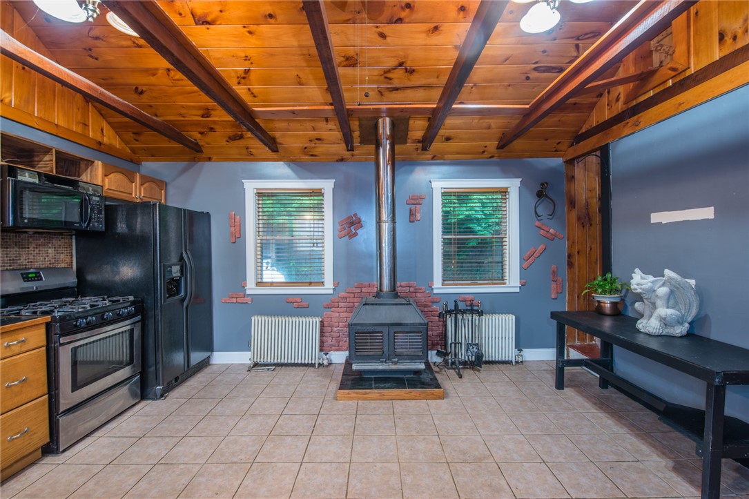 2944 East Main Road Portsmouth, RI 02871 - Photo 4 of 30 Kitchen, wood buning stove
