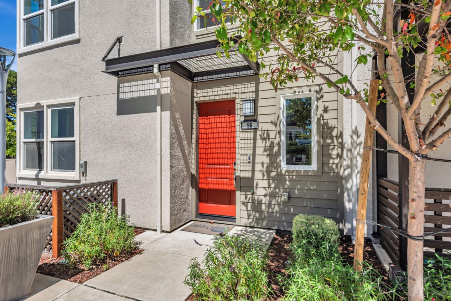 96 Zenith Common Fremont, CA 94539 - Photo 2 of 53 a front view of a house with plants