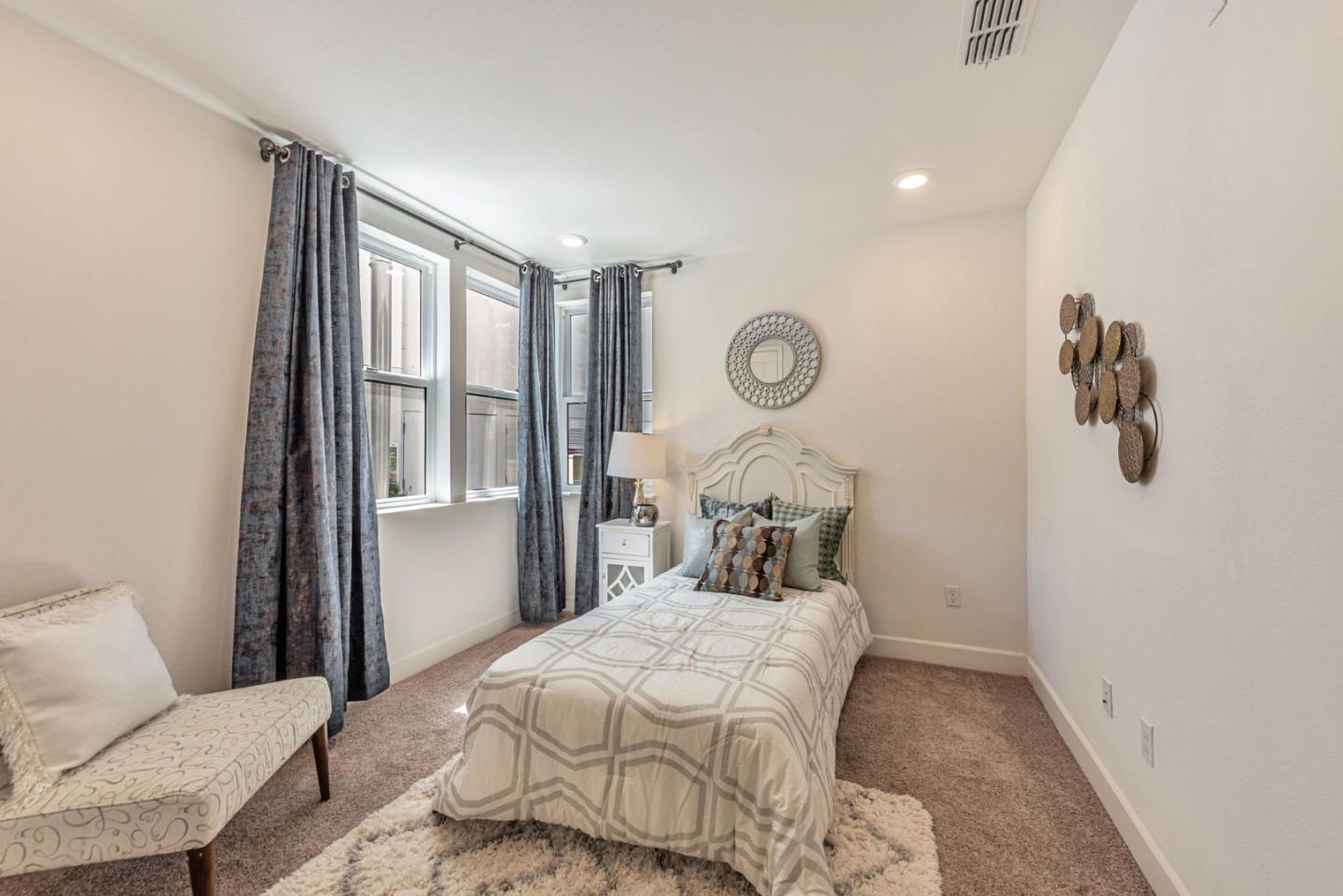 96 Zenith Common Fremont, CA 94539 - Photo 27 of 53 a bedroom with a bed and a window