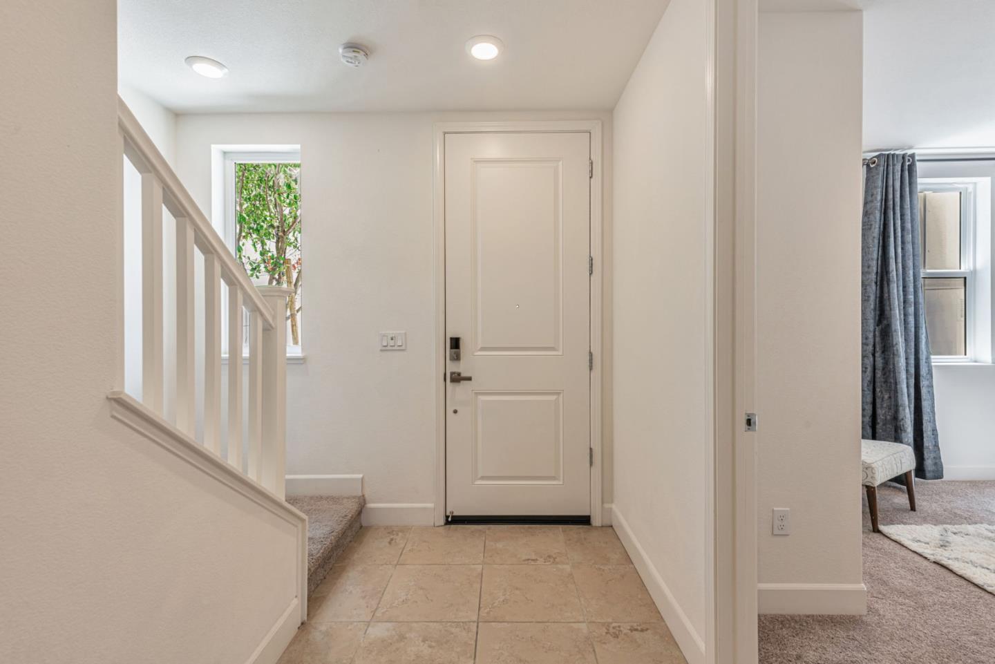 96 Zenith Common Fremont, CA 94539 - Photo 3 of 53 a view of a hallway with a hallway