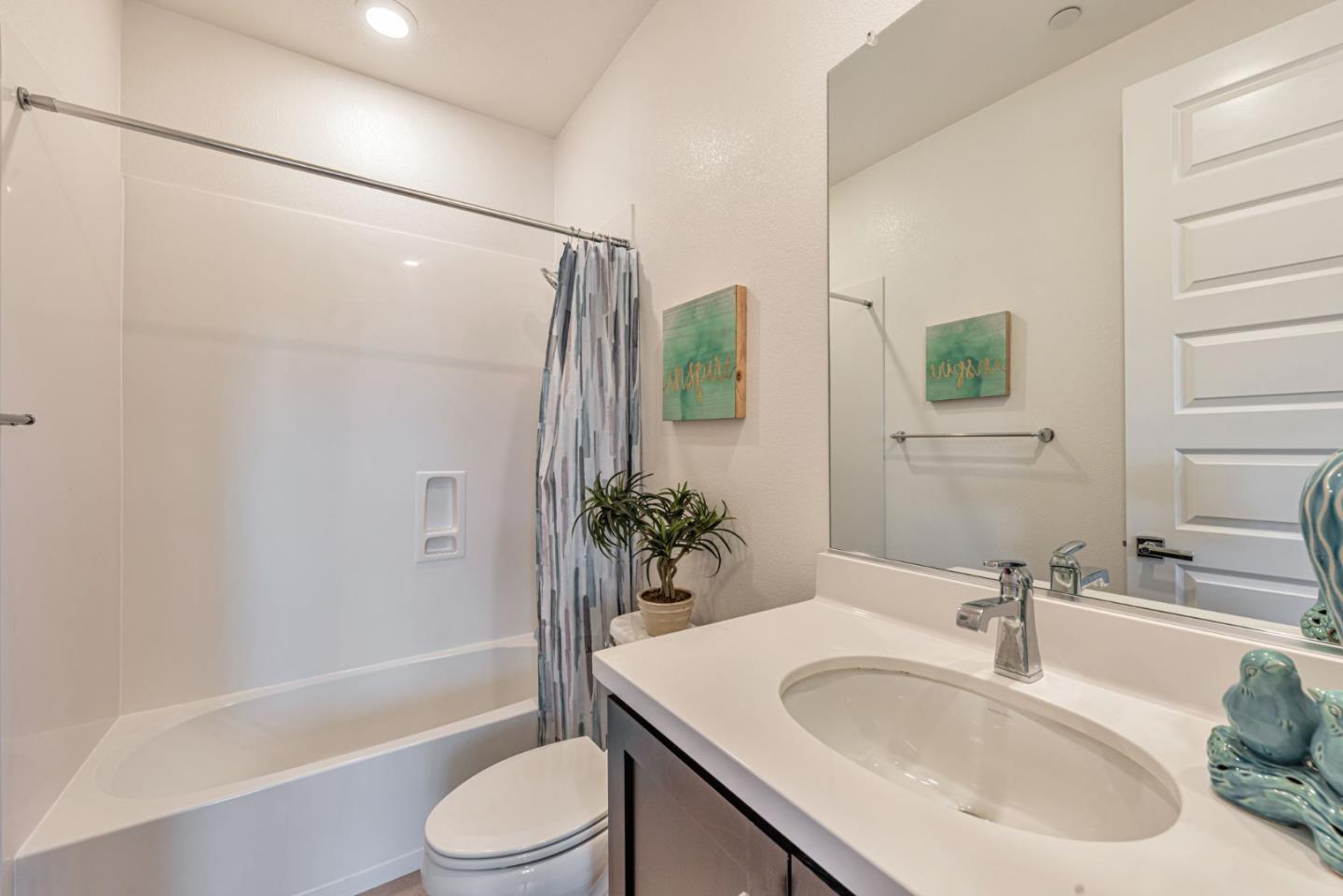 96 Zenith Common Fremont, CA 94539 - Photo 35 of 53 a bathroom with a sink toilet and shower