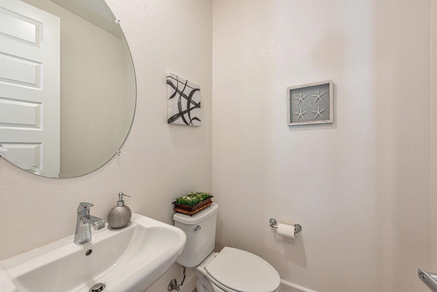 96 Zenith Common Fremont, CA 94539 - Photo 36 of 53 a bathroom with a toilet sink and mirror
