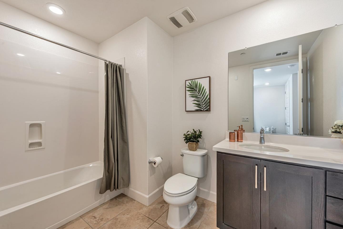 96 Zenith Common Fremont, CA 94539 - Photo 37 of 53 a bathroom with a toilet sink and a mirror