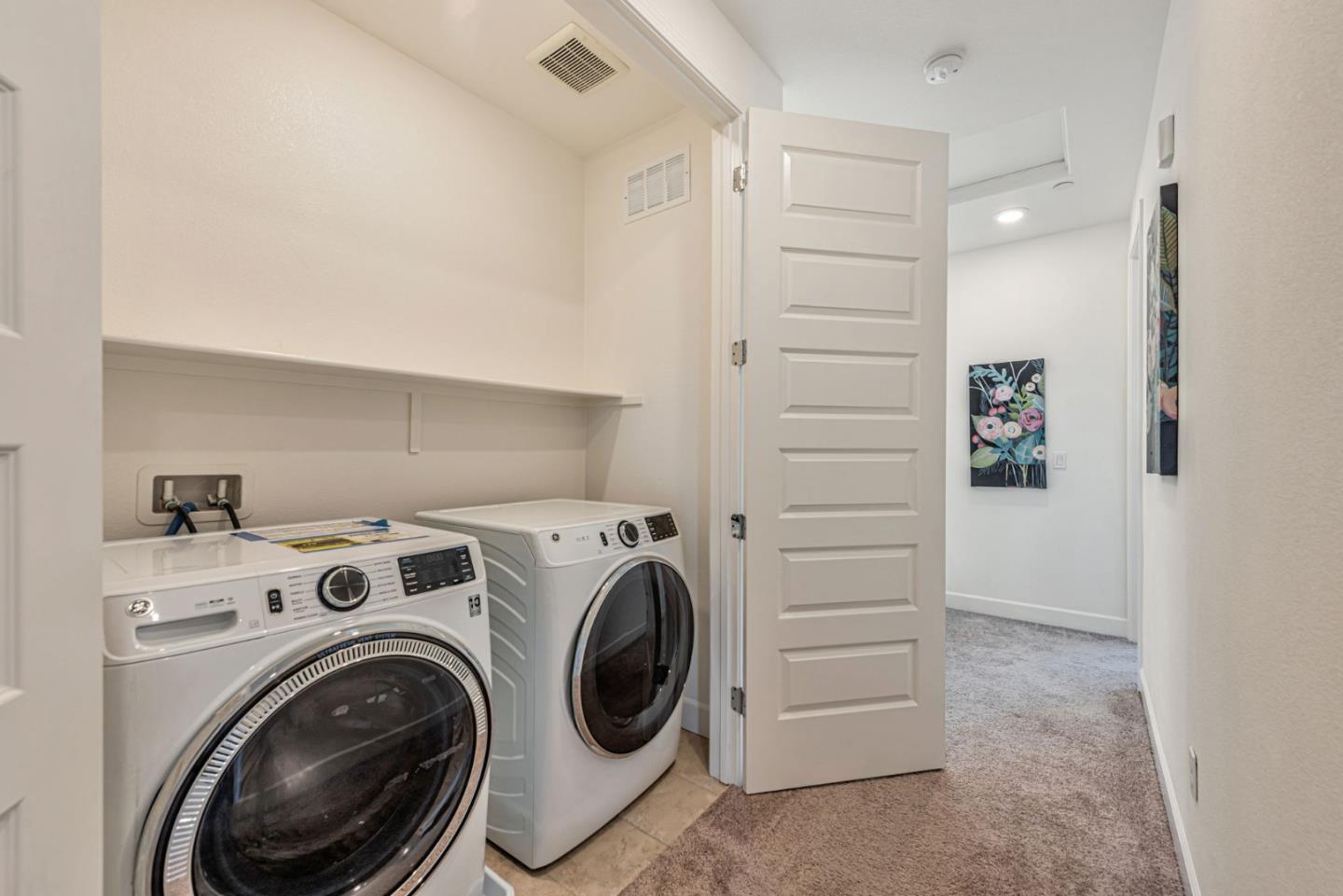 96 Zenith Common Fremont, CA 94539 - Photo 38 of 53 a view of hallway with washer and dryer