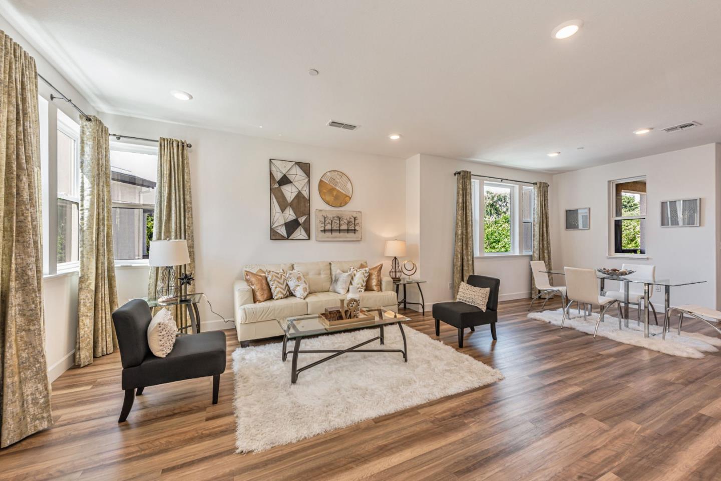 96 Zenith Common Fremont, CA 94539 - Photo 4 of 53 a living room with furniture and wooden floor