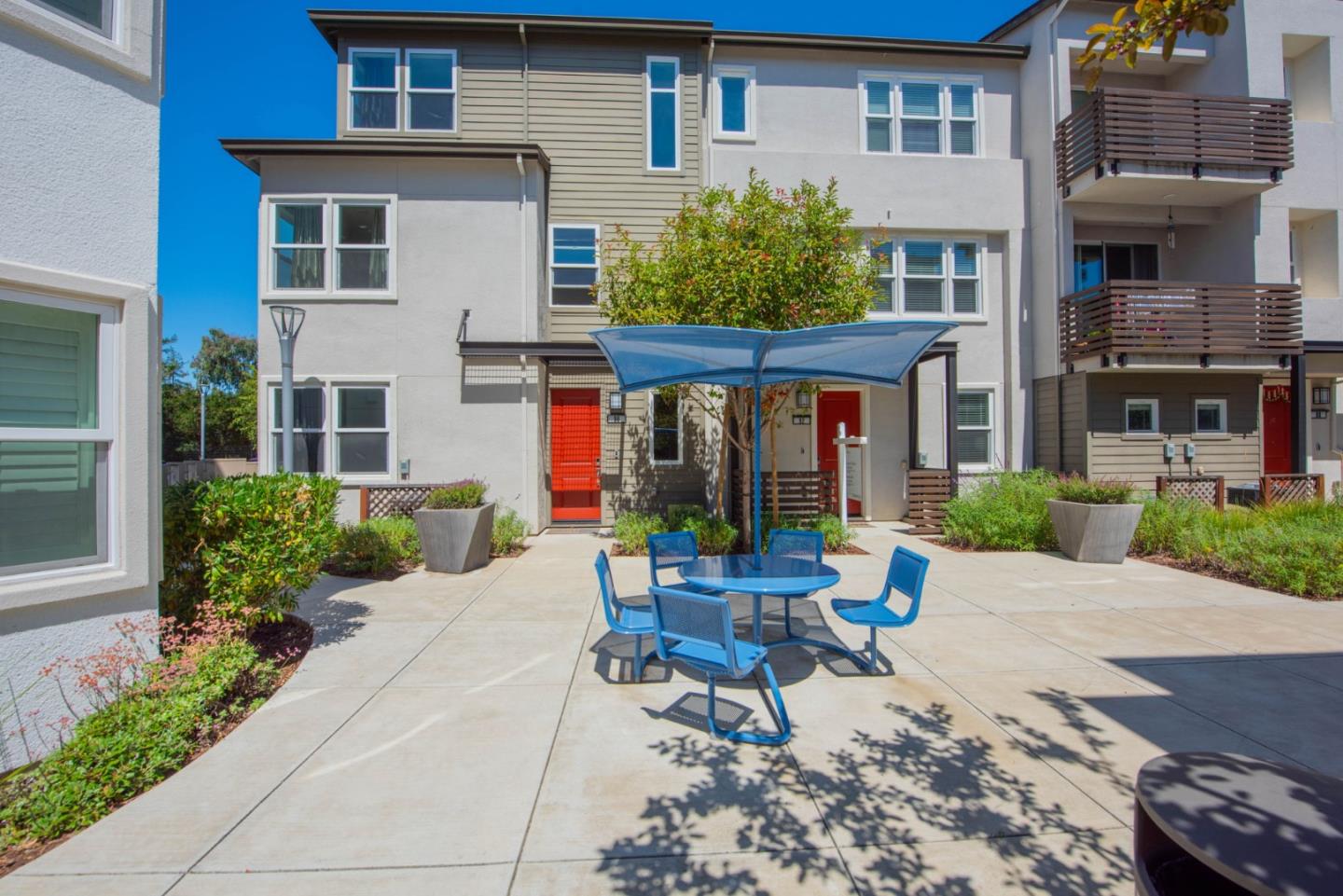 96 Zenith Common Fremont, CA 94539 - Photo 46 of 53 a view of a building with a patio