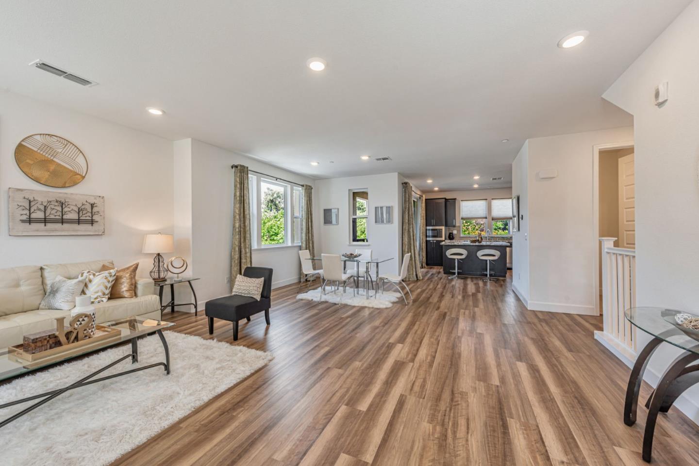 96 Zenith Common Fremont, CA 94539 - Photo 6 of 53 a living room with furniture and a wooden floor