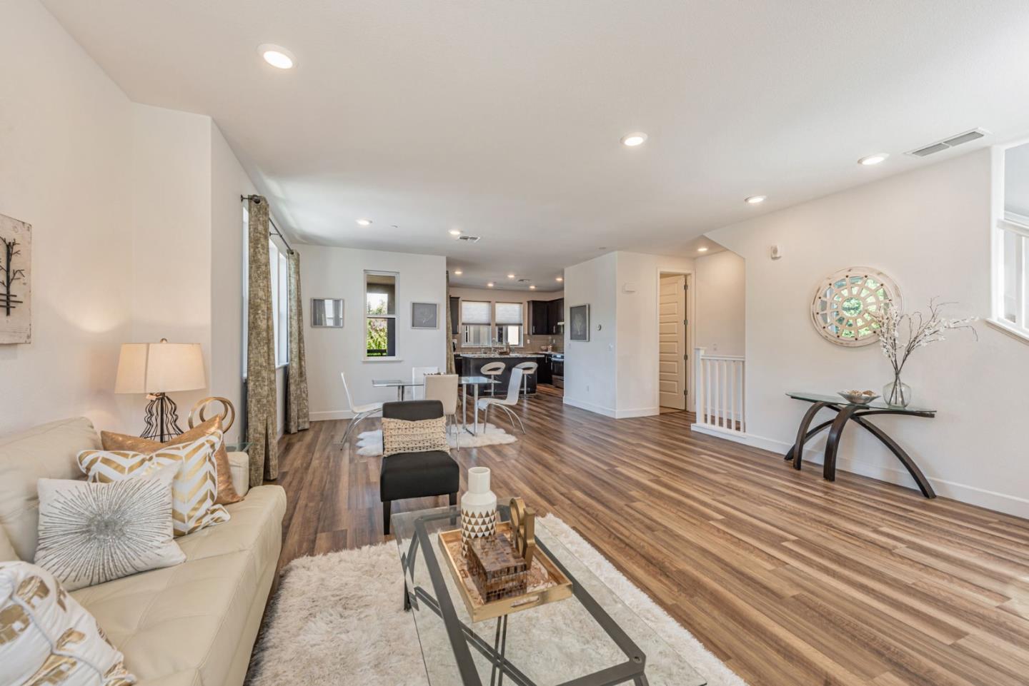 96 Zenith Common Fremont, CA 94539 - Photo 7 of 53 a living room with furniture and kitchen view