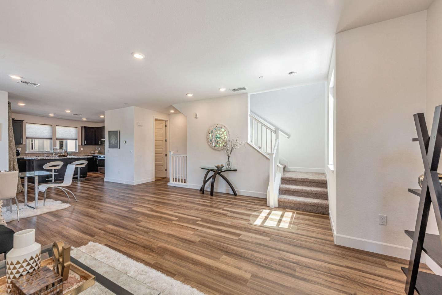 96 Zenith Common Fremont, CA 94539 - Photo 9 of 53 a view of kitchen with furniture and wooden floor