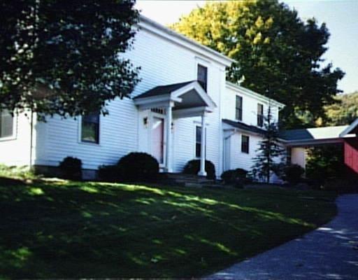 74 Sullivan Road New Milford, CT 06776 - Photo 1 of 1 a front view of a house with a garden