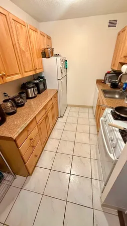 a kitchen with a stove and a refrigerator