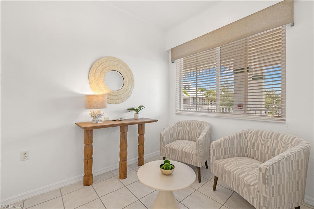 7940 Mahogany Run Lane, Unit 625 Naples, FL 34113 - Photo 15 of 30 a living room with furniture and a window