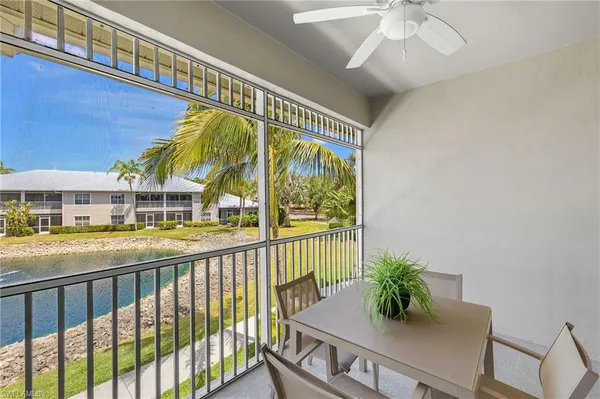 a view of a balcony and swimming pool