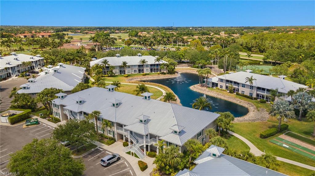 7940 Mahogany Run Lane, Unit 625 Naples, FL 34113 - Photo 19 of 30 an aerial view of residential houses with outdoor space