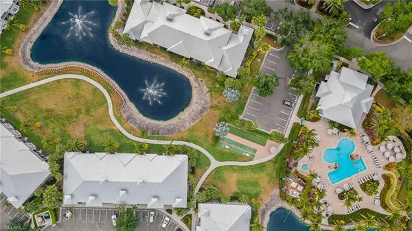 an aerial view of a house with swimming pool and outdoor space