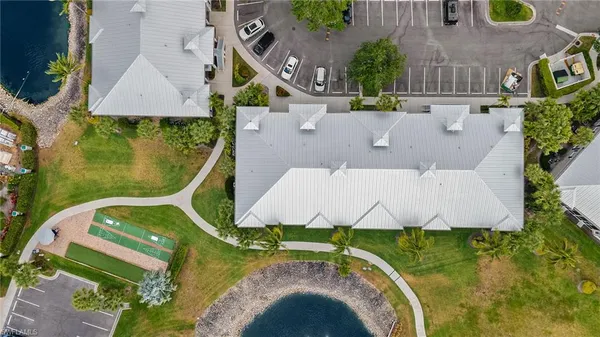an aerial view of a house with a swimming pool