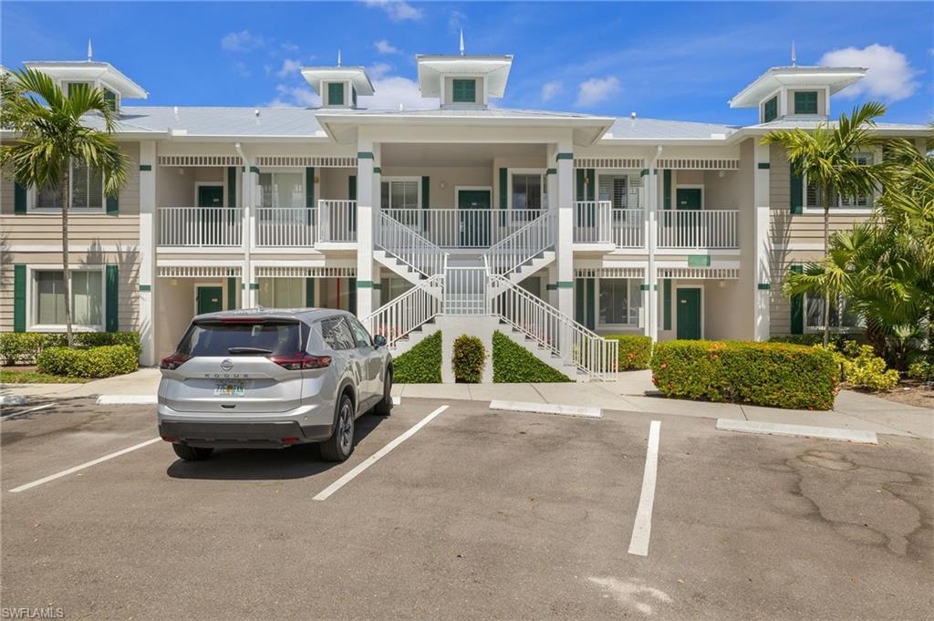 7940 Mahogany Run Lane, Unit 625 Naples, FL 34113 - Photo 29 of 30 a front view of a house with parking space and plants
