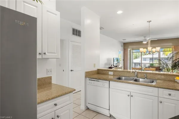 a kitchen with sink and window