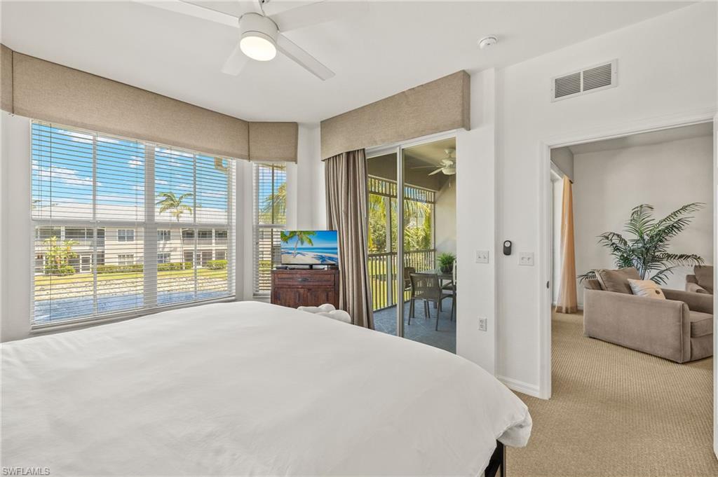 7940 Mahogany Run Lane, Unit 625 Naples, FL 34113 - Photo 9 of 30 a bedroom with a large bed and a large window