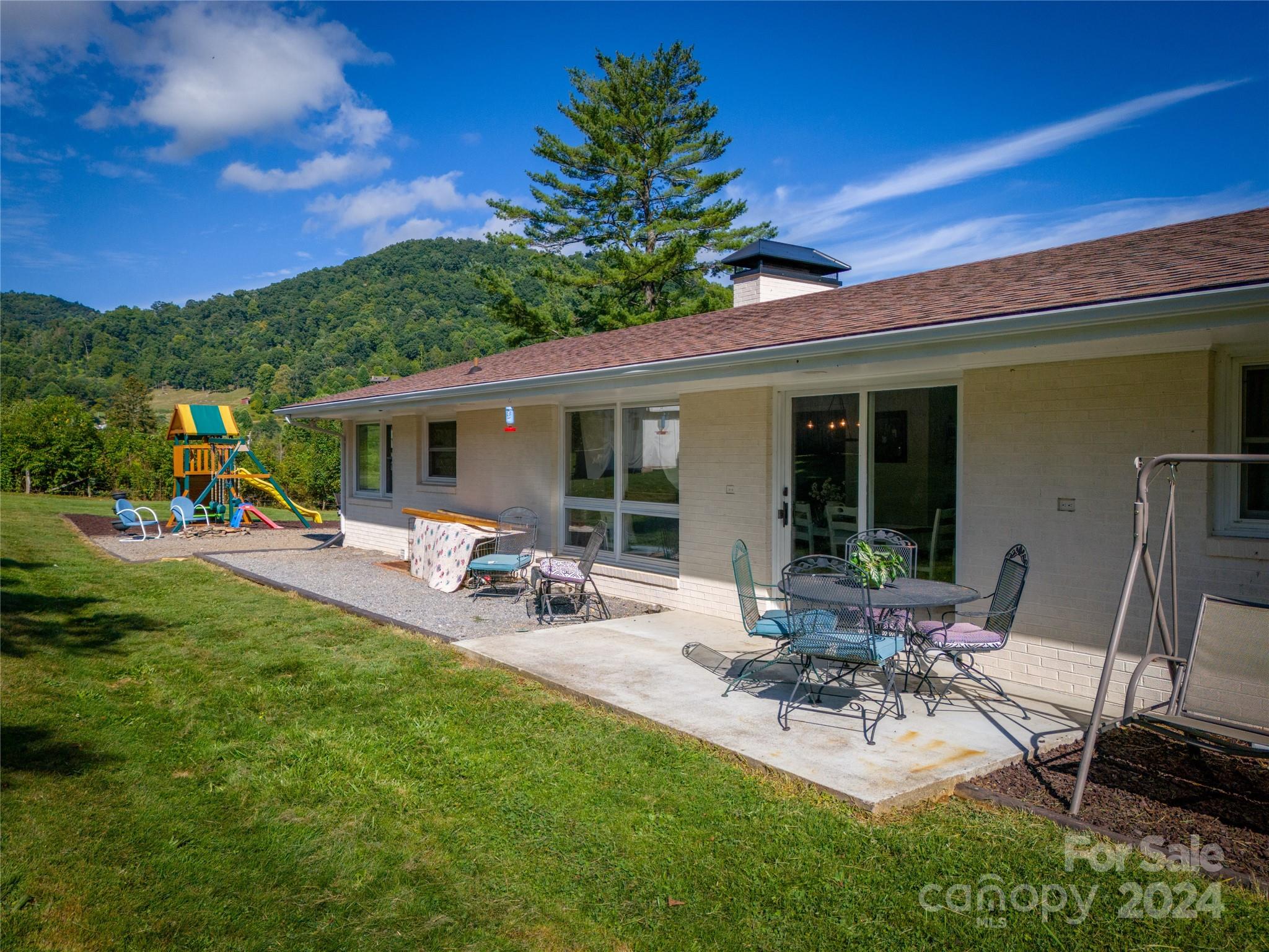 10 Elbert Burnett Road Canton, NC 28716 - Photo 2 of 39 a view of a backyard with sitting area and garden