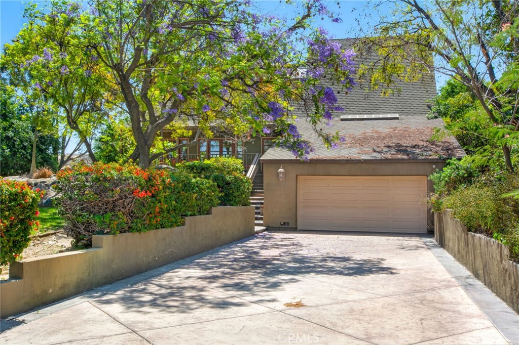 7241 Old Temescal Road Corona, CA 92881 - Photo 1 of 47 a front view of a house with a yard and garage
