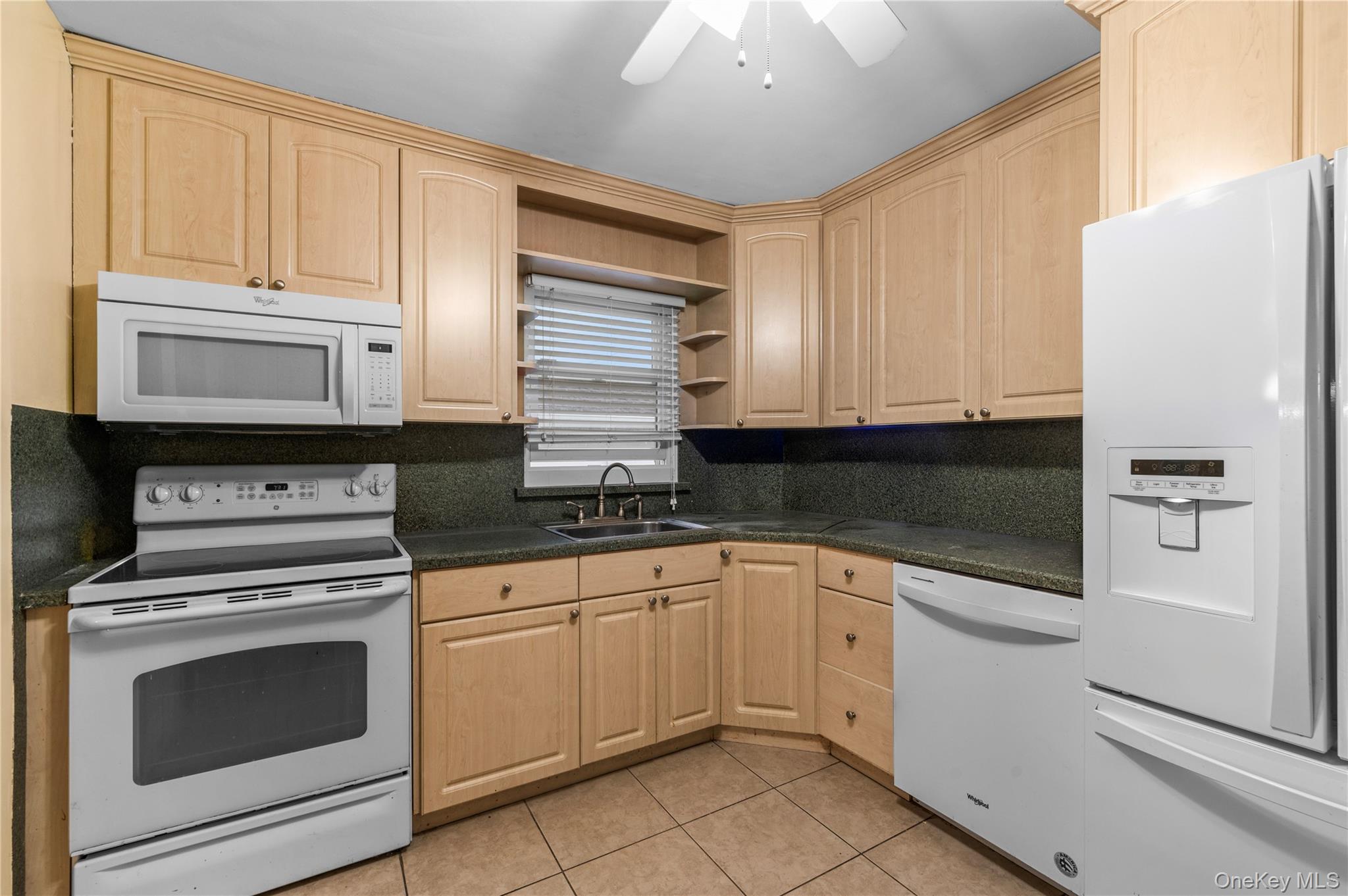 3 Cheshire Road Bethpage, NY 11714 - Photo 7 of 26 a kitchen with granite countertop white cabinets white stainless steel appliances and sink