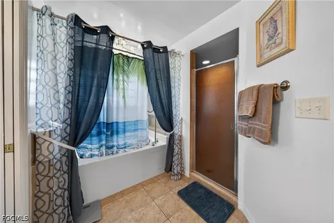 a bathroom with a shower and a tub
