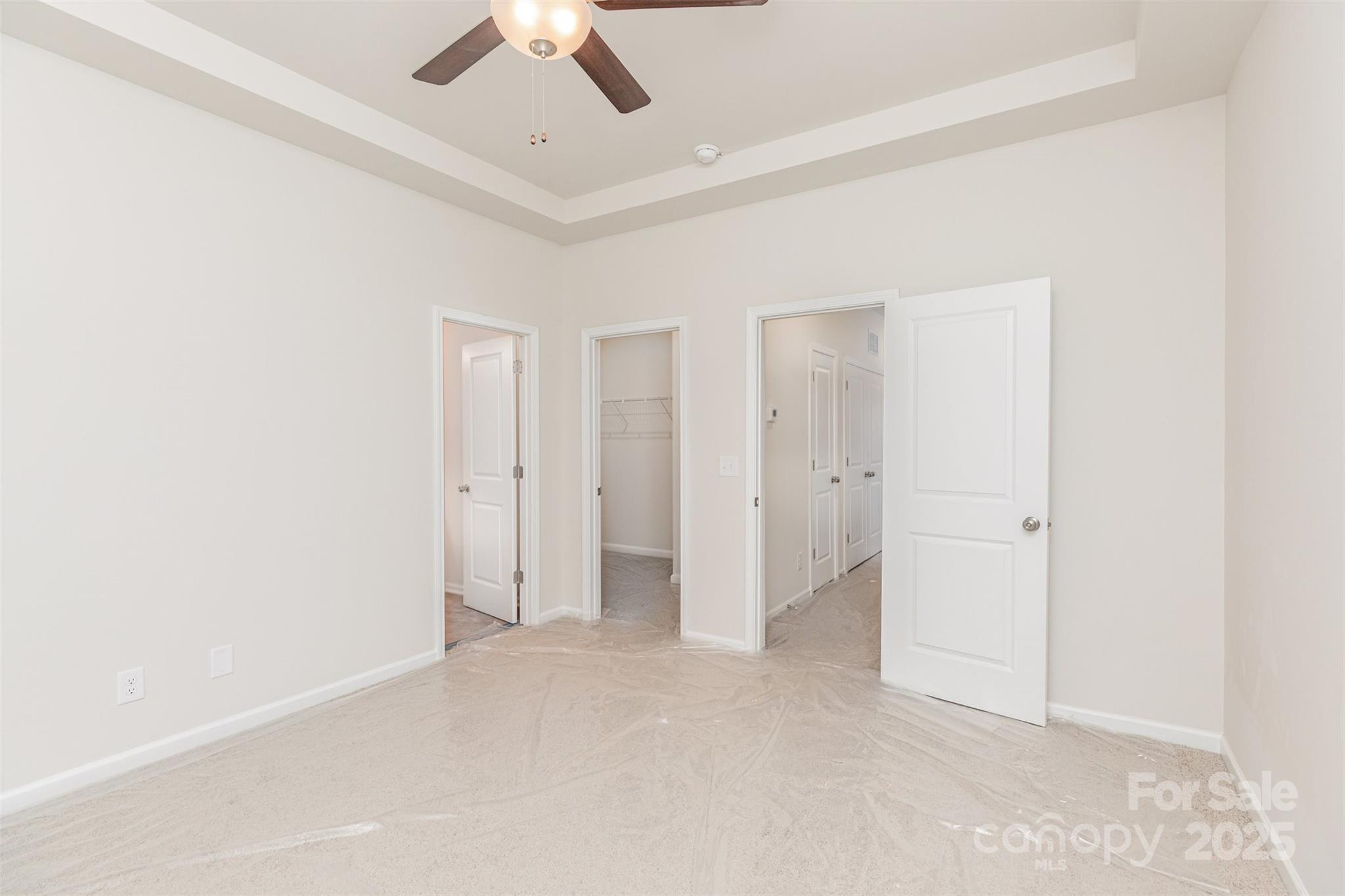 7304 Boswell Road Charlotte, NC 28215 - Photo 17 of 30 an empty room with a ceiling fan and closet