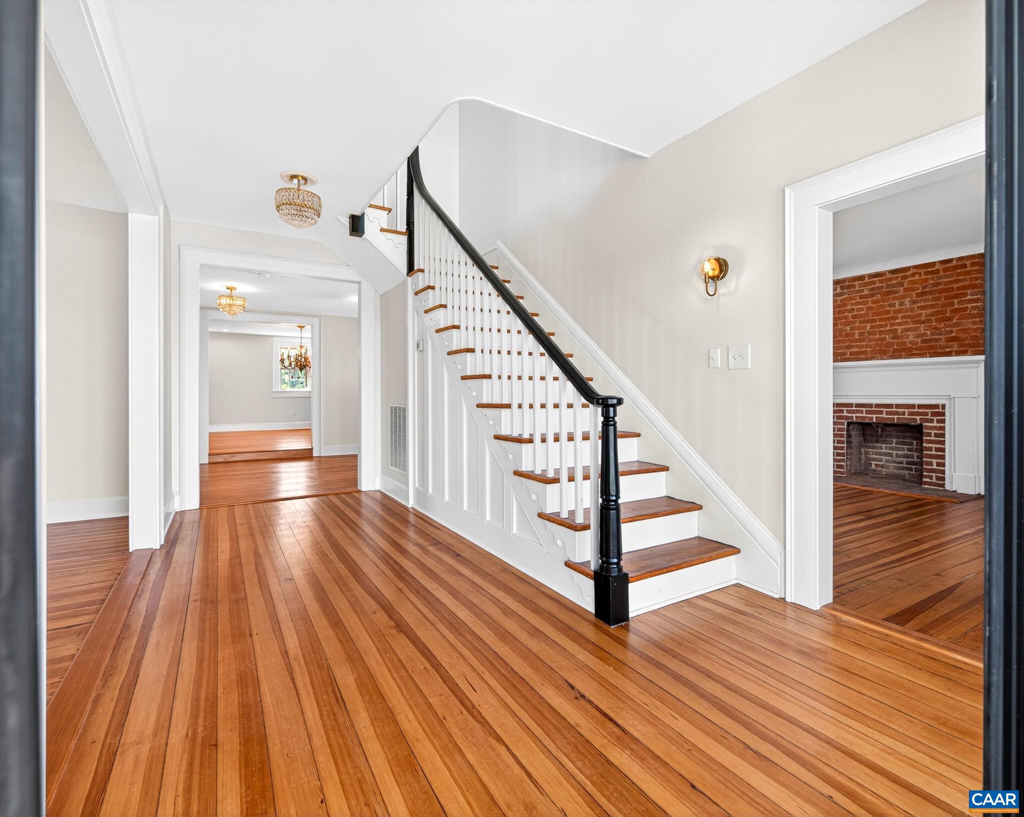 481 Race Ground Road Somerset, VA 22972 - Photo 5 of 53 a view of a hallway with wooden floor and staircase