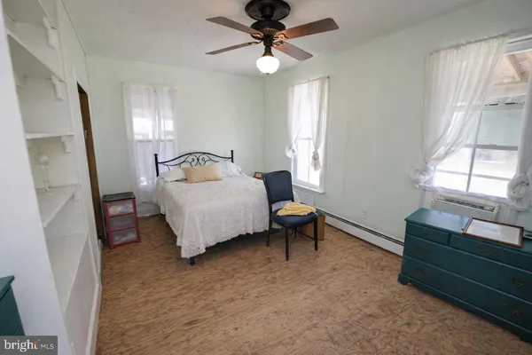 a bedroom with a bed and chandelier