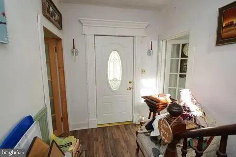 a bathroom with a toilet a sink a mirror and shower