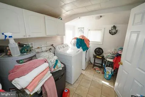 a bathroom with a toilet and a shower curtain
