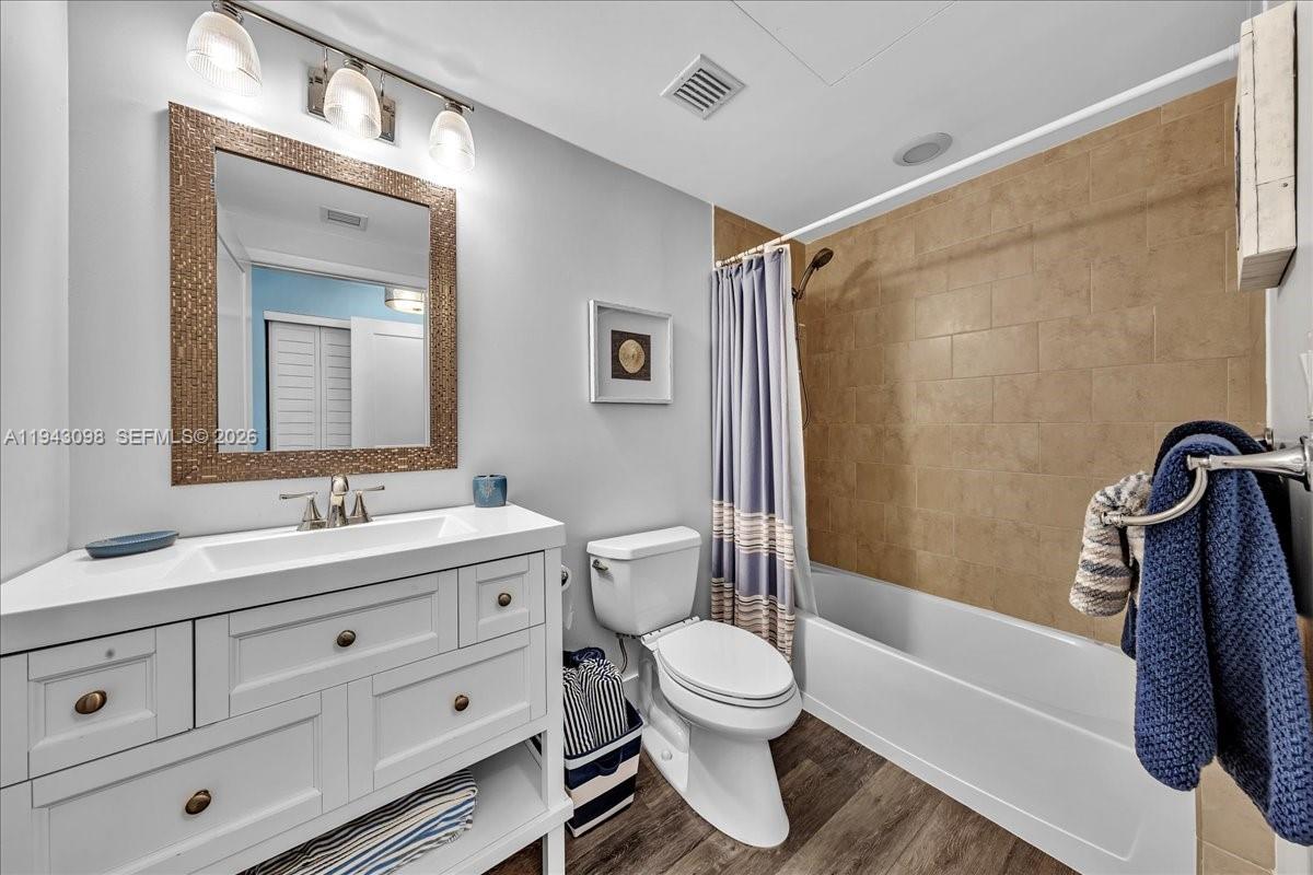 90 Southwest 3rd Street, Unit 2604 Miami, FL 33130 - Photo 30 of 59 a bathroom with a sink a toilet and shower