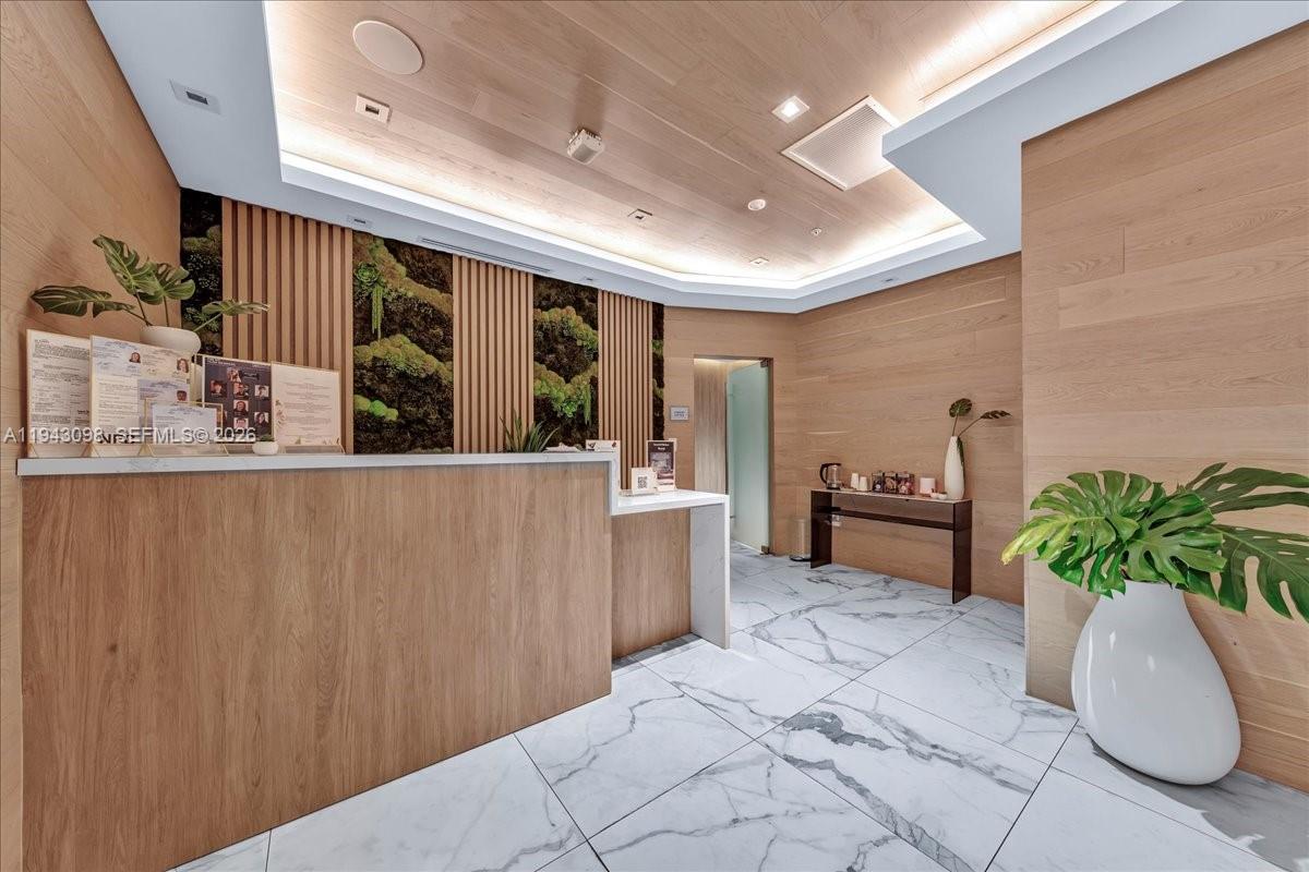 90 Southwest 3rd Street, Unit 2604 Miami, FL 33130 - Photo 49 of 59 a lobby with furniture and potted plant