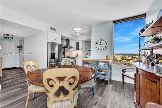 a bed room with a bed a table and chair