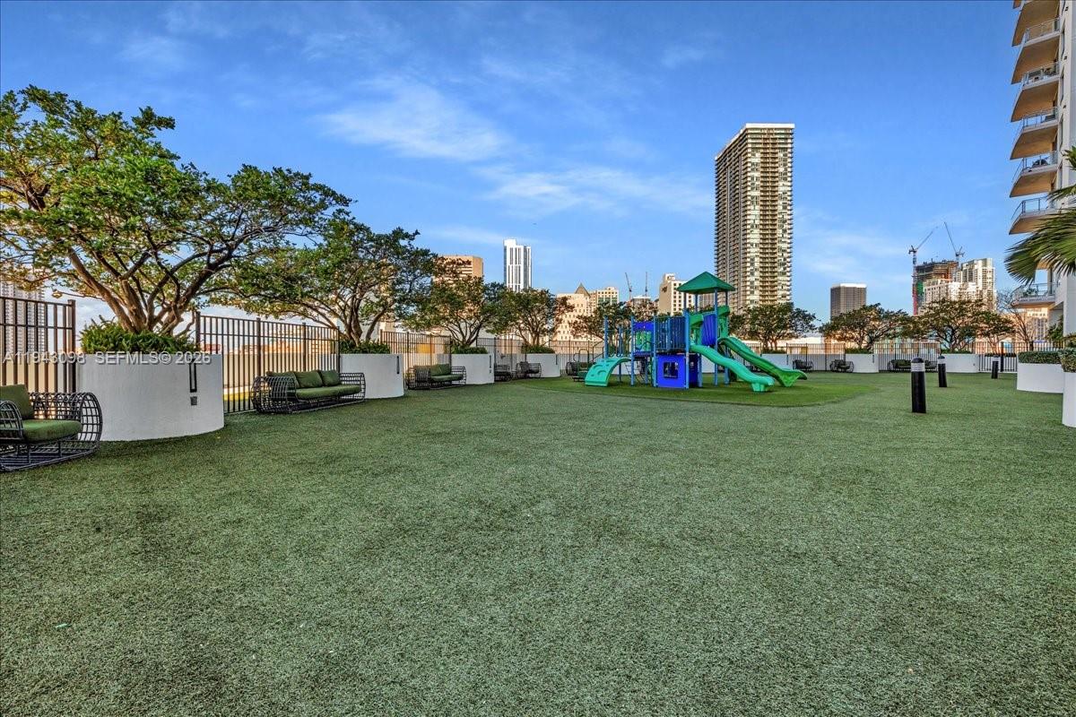 90 Southwest 3rd Street, Unit 2604 Miami, FL 33130 - Photo 55 of 59 a view of a garden with a building and a park