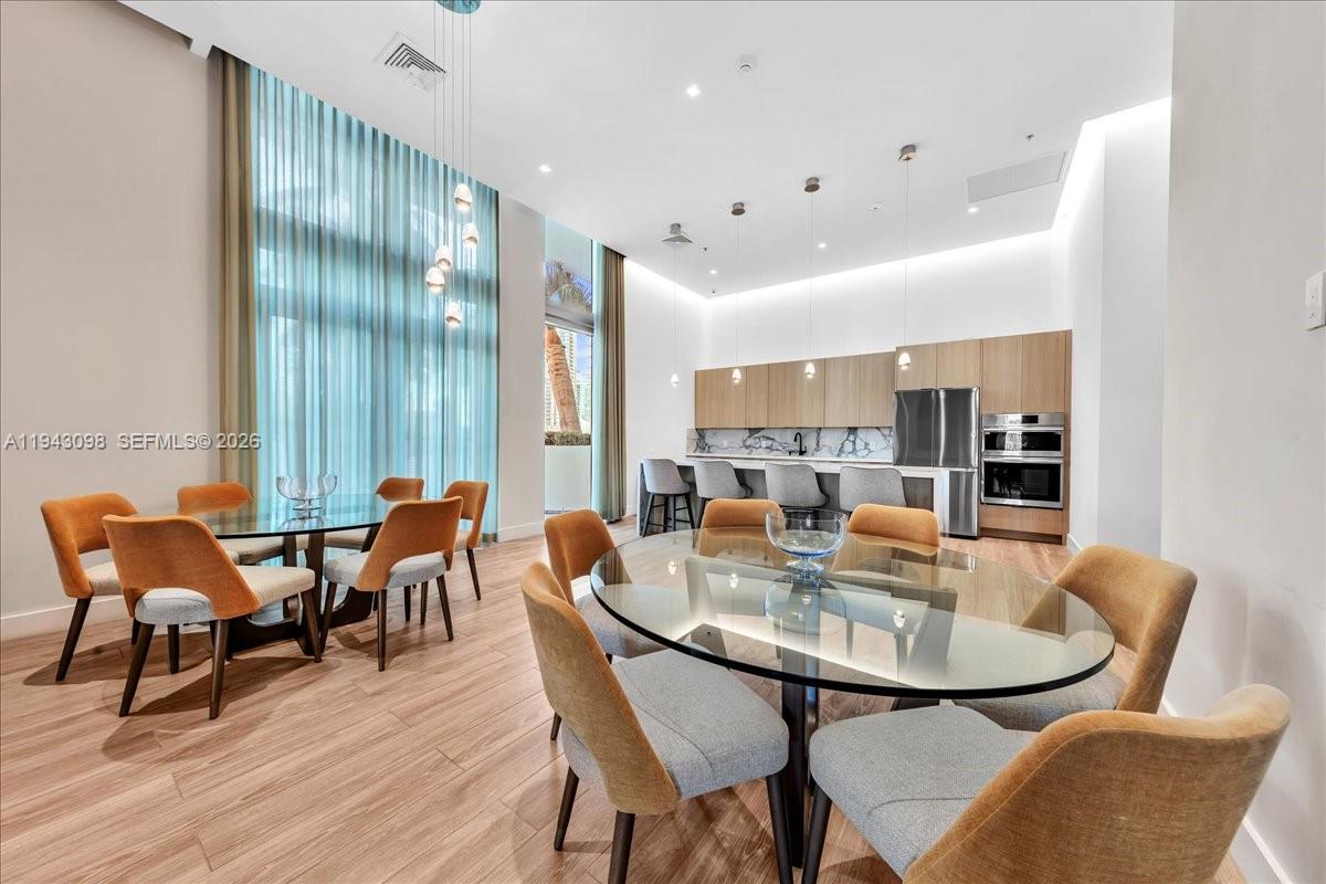 90 Southwest 3rd Street, Unit 2604 Miami, FL 33130 - Photo 56 of 59 a view of a dining room with furniture