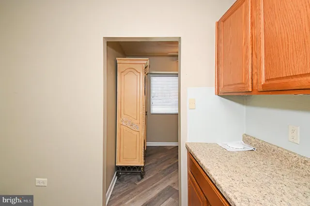 a kitchen with a granite countertop window and a sink