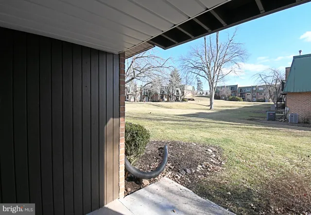 a view of a backyard of the house
