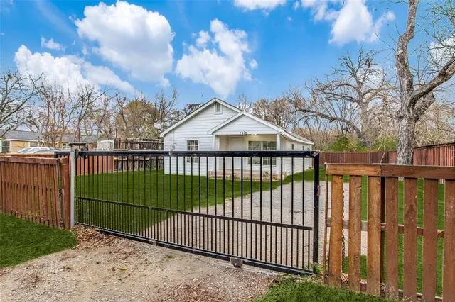 a view of a wrought iron fences in front of house