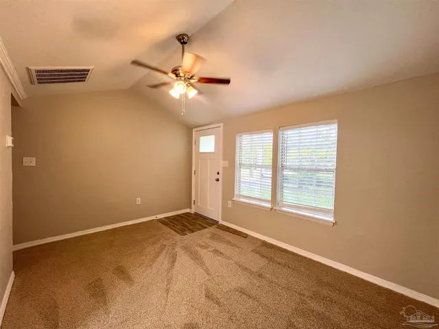 a view of an empty room with a window