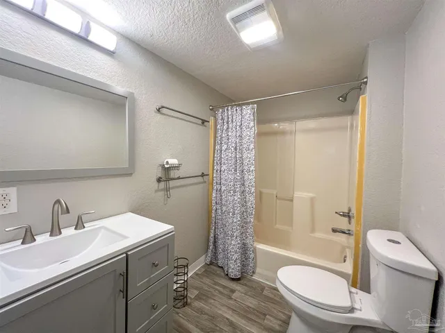 a bathroom with a sink toilet a shower and a mirror