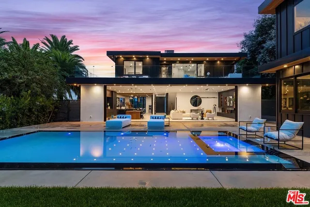 a view of swimming pool with outdoor seating