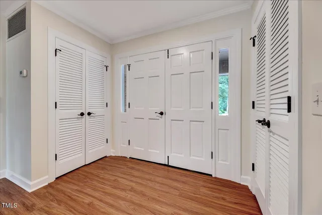 a view of a house with backyard and a tree