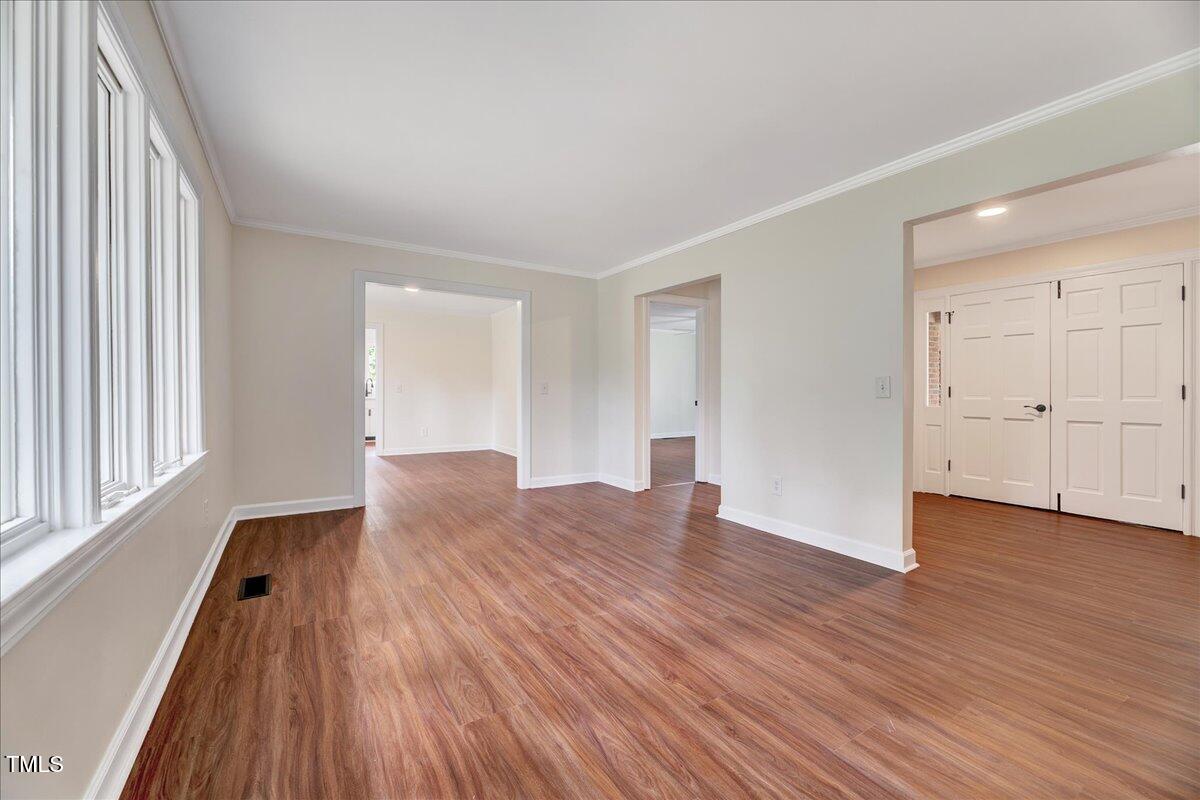2585 Cabin Branch Road Kinston, NC 28504 - Photo 19 of 42 wooden floor in an empty room with a window