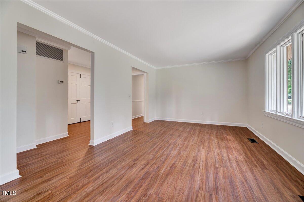 2585 Cabin Branch Road Kinston, NC 28504 - Photo 21 of 42 wooden floor in an empty room with a window
