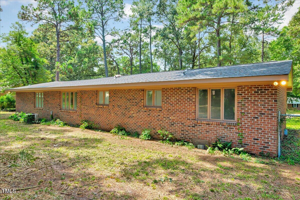 2585 Cabin Branch Road Kinston, NC 28504 - Photo 31 of 42 a view of a house with a yard