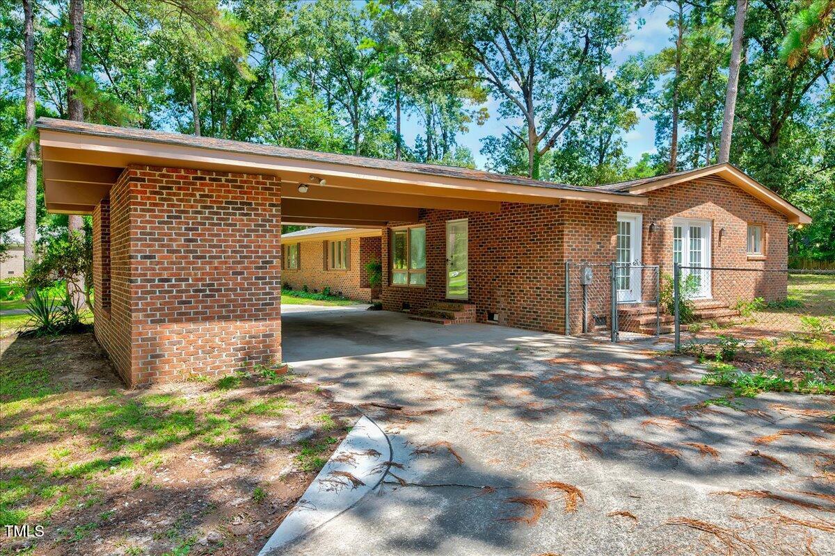 2585 Cabin Branch Road Kinston, NC 28504 - Photo 34 of 42 a front view of a house with a yard and garage
