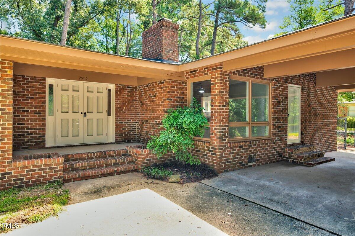 2585 Cabin Branch Road Kinston, NC 28504 - Photo 36 of 42 a front view of a house with a yard and garage